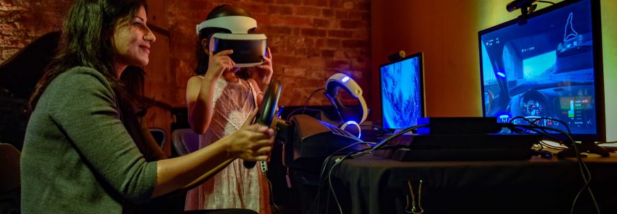 family_playing_video_games_at_the_science_and_industry_museums_power_up_gaming_experience