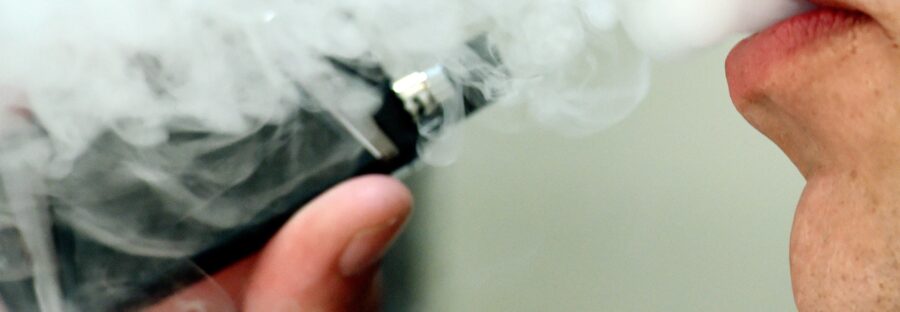 Man inhaling a vape