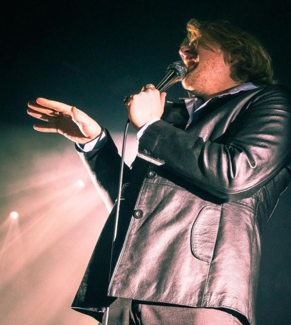 Thornhill frontman singing in to microphone, shot by Kayleigh Fryer 